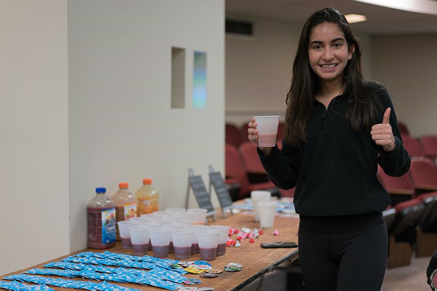 Samira Saran holds up a smoothie at the “STI’s &amp; Smoothies” event. The event was held in CGS on March 29. PHOTO BY DENGFENG YANG/DAILY FREE PRESS STAFF
