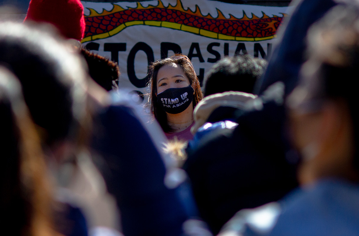 woman wearing a stop asian hate mask