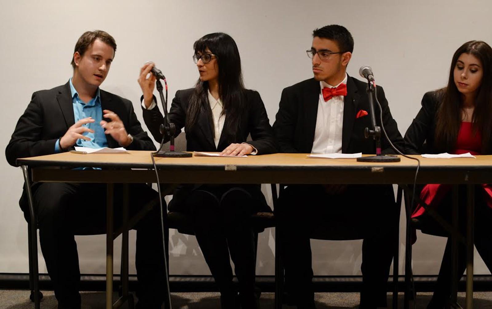 NewBU's VP candidate Petar Ojdrovic, a sophomore in the College of Engineering, speaks at the 2016 Student Government Election Slate Debate on Thursday. He sits alongside Presidential candidate and ENG sophomore Nadia Asif; VP of Finance candidate Atid Malka, a freshman in the College of Arts and Sciences; and VP of IA candidate Rachel Feigelson, a sophomore in the College of General Studies. PHOTO BY SAVANAH MACDONALD/DAILY FREE PRESS STAFF
