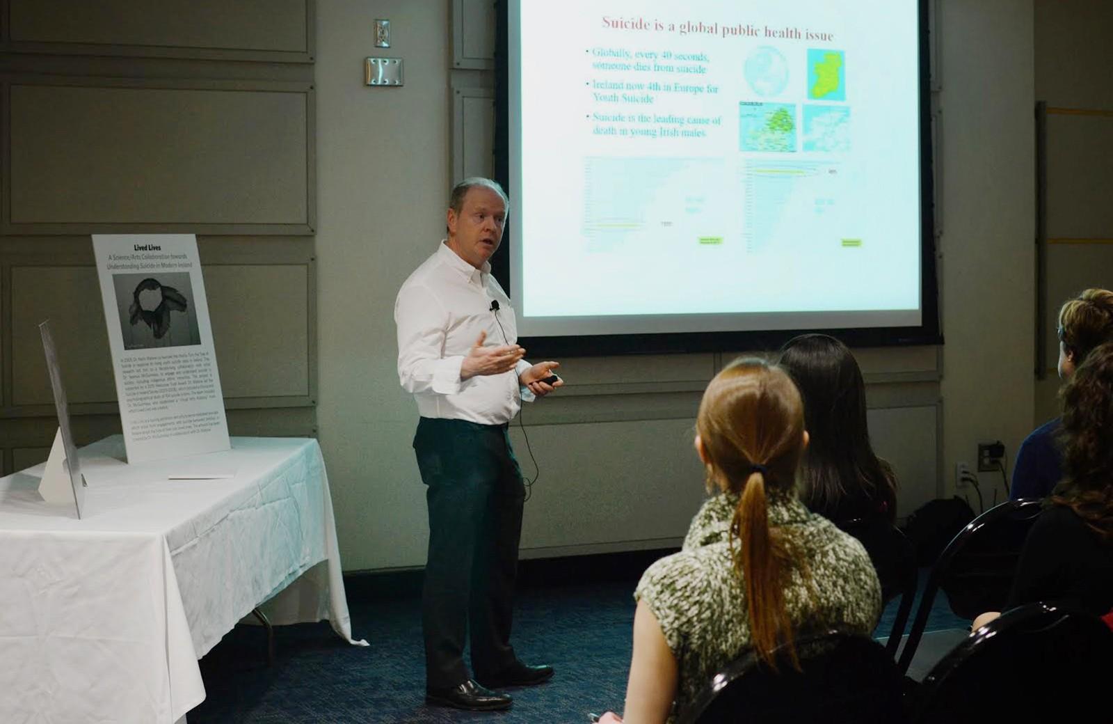Visiting Irish psychiatrist Kevin Malone speaks at the "Stop the Silence" event held in Photonics Thursday night. PHOTO BY SAVANAH MACDONALD/DAILY FREE PRESS STAFF
 