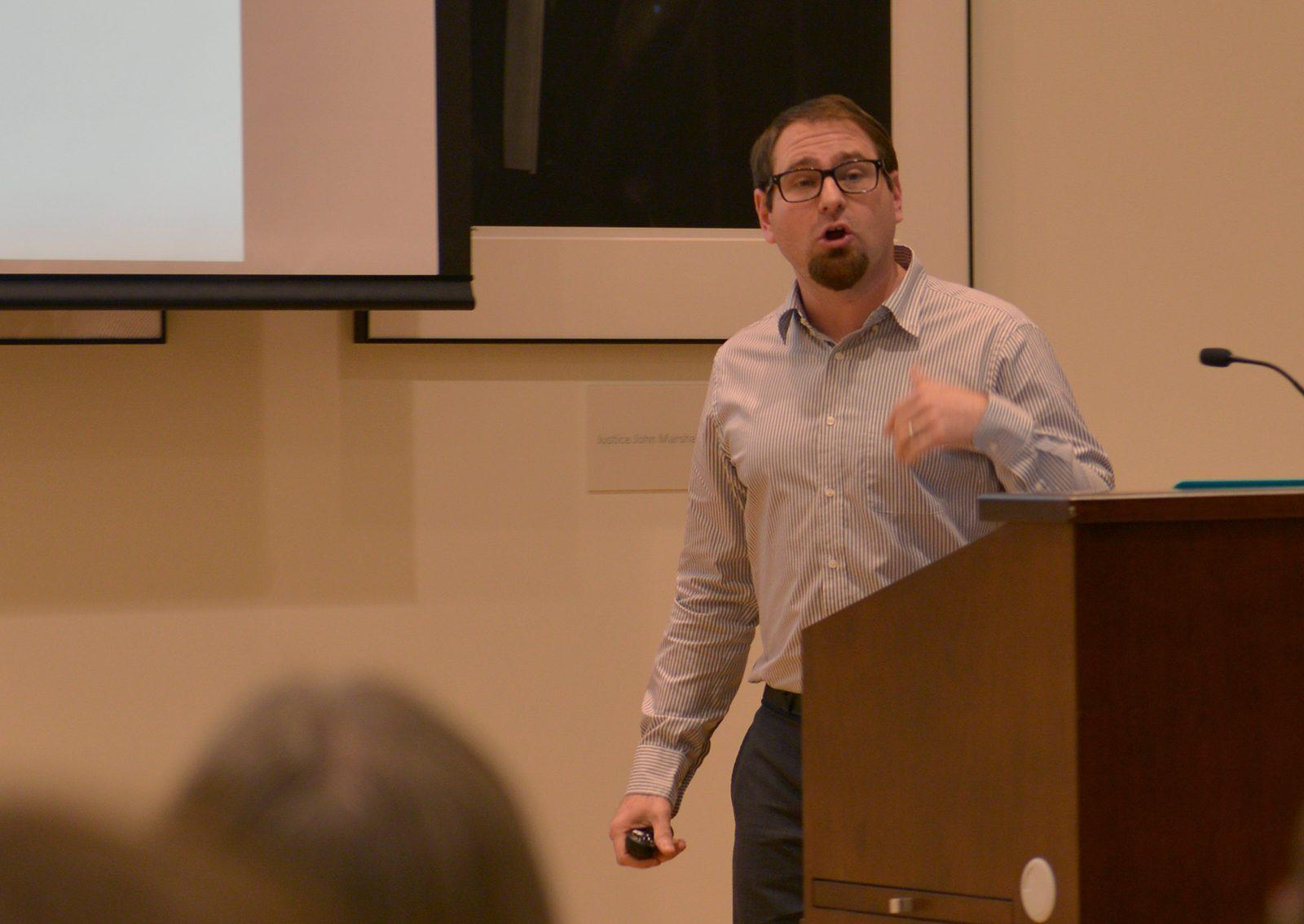 Dylan Walker, a professor of information systems in the Questrom School of Business, presents his experiment on social network chains during the “Shaping the New Human-Technology Frontier: Current Research at BU” event Tuesday afternoon in Barrister's Hall as part of the Research on Tap lecture series. PHOTO BY SHANE FU/ DAILY FREE PRESS STAFF