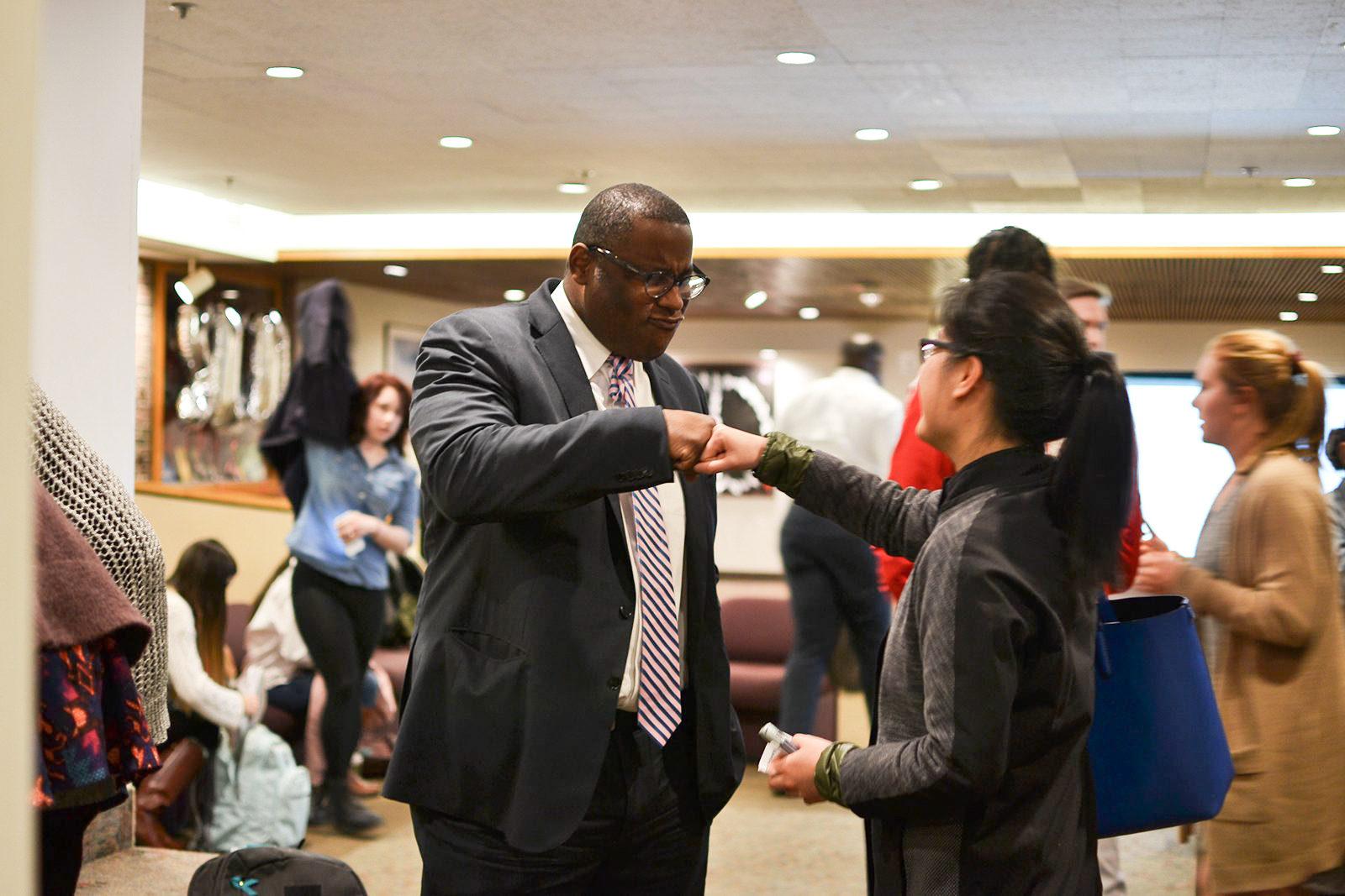 Campaigner Sam Kubota speaks to Tito Jackson April 18 following his visit to Boston University. PHOTO BY CHLOE GRINBERG/ DFP FILE PHOTO