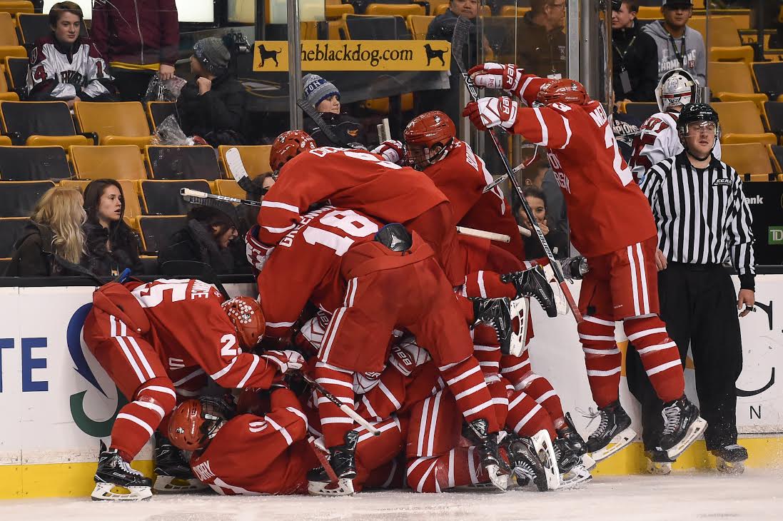 BU celebrating after freshman forward Ty Amonte's game-winning goal on Monday night at TD Garden. PHOTO BY MADDIE MALHOTRA/ DAILY FREE PRESS STAFF