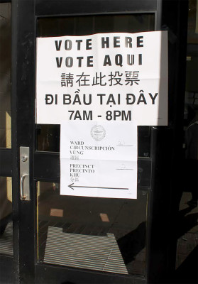 A “Vote Here” sign displayed at the 111 Cummington Ave. polling location Tuesday afternoon. PHOTO BY MADISON GOLDMAN/DAILY FREE PRESS STAFF