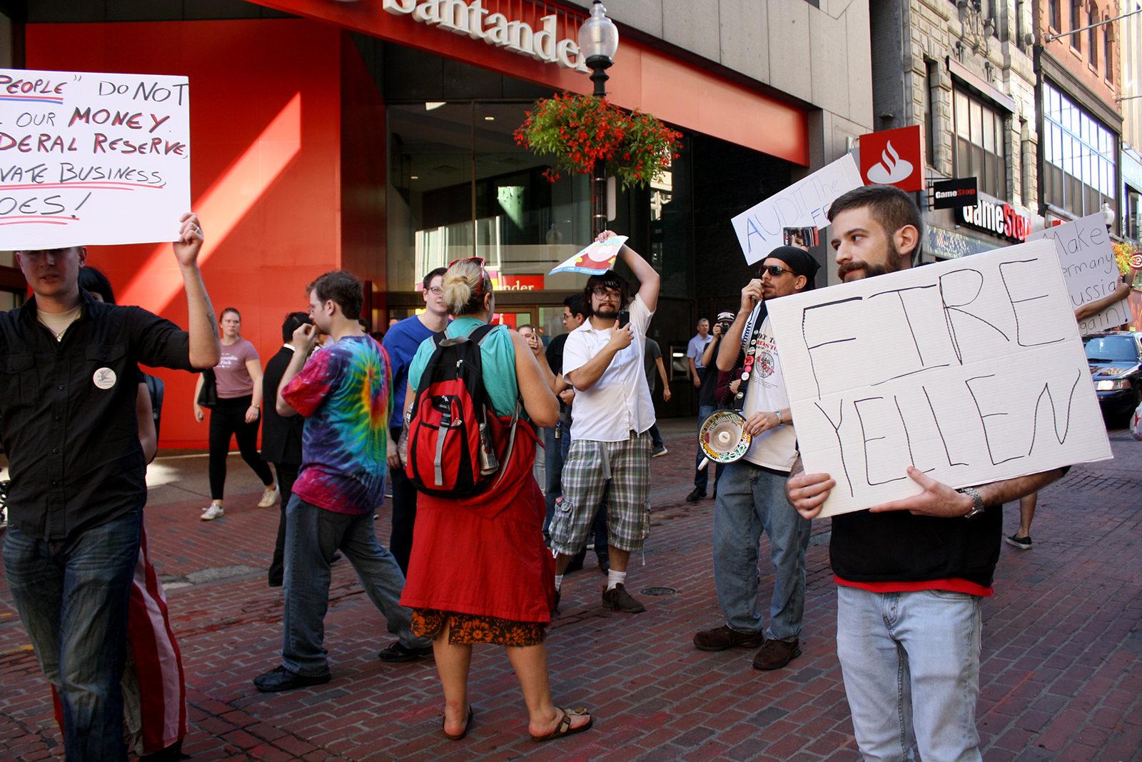 Marcelo Guadiana marches to the Federal Reserve building during “Boston Audit the Fed” Saturday afternoon hosted by the University of Massachusetts Boston’s chapter of Young Americans for Liberty. PHOTO BY JESS RICHARDSON/ DAILY FREE PRESS STAFF